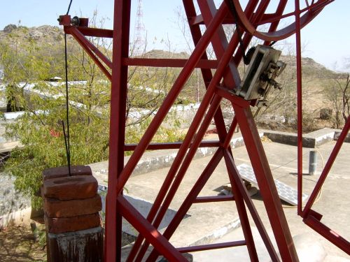 The collector pivots horizontally during the day to track the sun, using a system of coutnerweights like a grandfather clock